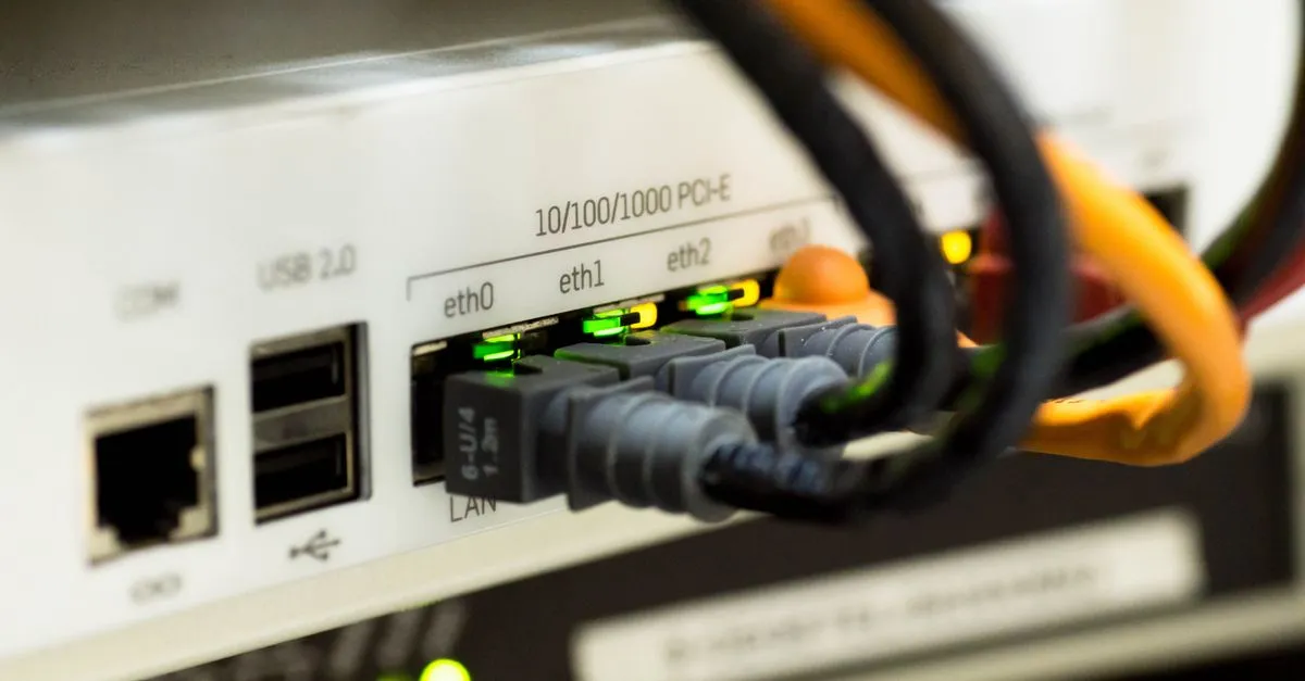 A ceiling-mounted business Wi-Fi access point in an office